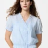 Blusa de algodón con cuello en V y tejido dobby para mujer Blusa de algodón con cuello en V y tejido dobby para mujer