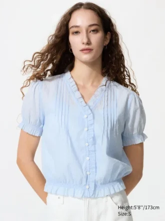 Blusa de algodón con cuello en V y tejido dobby para mujer